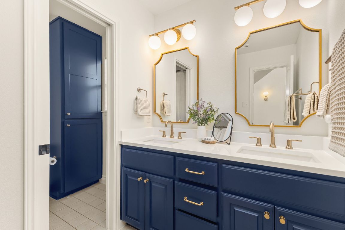 4312 Rosedale Avenue Austin, TX 78756 - Photo 32 of 40 Bathroom with double vanity and light tile patterned floors