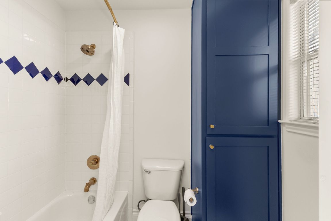 4312 Rosedale Avenue Austin, TX 78756 - Photo 33 of 40 Bathroom featuring shower / bath combination with curtain and toilet