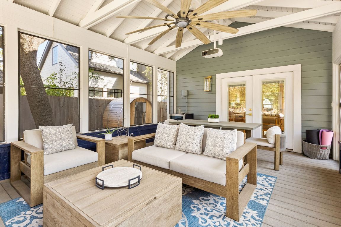 4312 Rosedale Avenue Austin, TX 78756 - Photo 35 of 40 Screened in sunroom with outdoor lounge area, plenty of natural light, and a ceiling fan