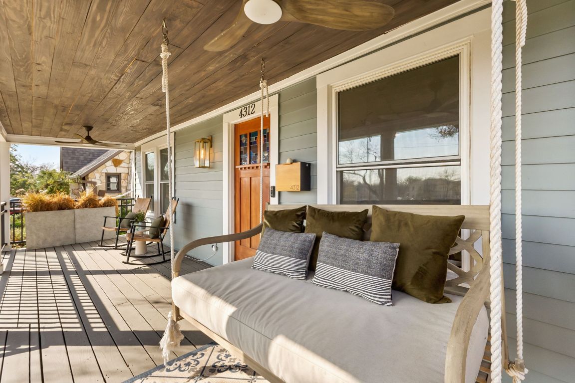 4312 Rosedale Avenue Austin, TX 78756 - Photo 38 of 40 Wooden porch with a ceiling fan and swing