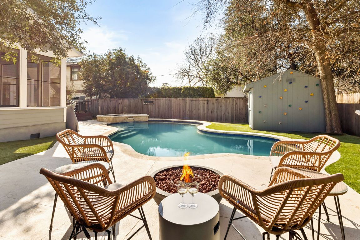4312 Rosedale Avenue Austin, TX 78756 - Photo 10 of 40 View of pool with an outdoor fire pit, a storage unit, a fenced backyard, and a patio