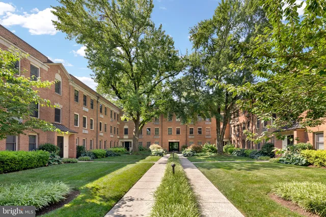 a view of a building with a yard