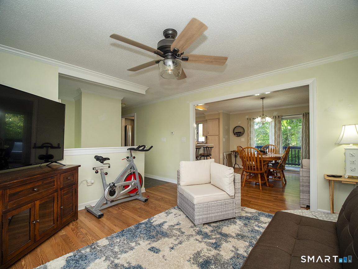 82 Wilcox Road Middletown, CT 06457 - Photo 12 of 27 a living room with furniture and a flat screen tv