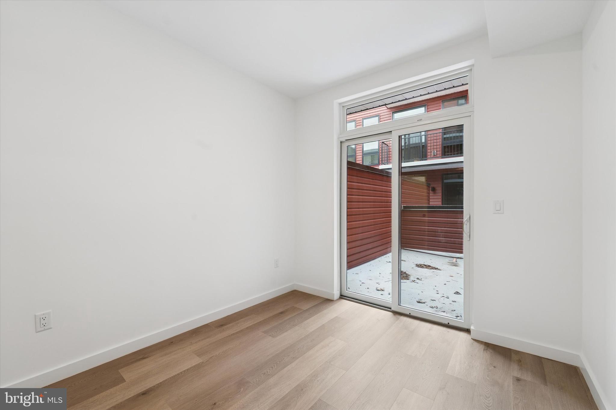 754 South 4th Street, Unit 405 Philadelphia, PA 19147 - Photo 11 of 18 wooden floor in an empty room