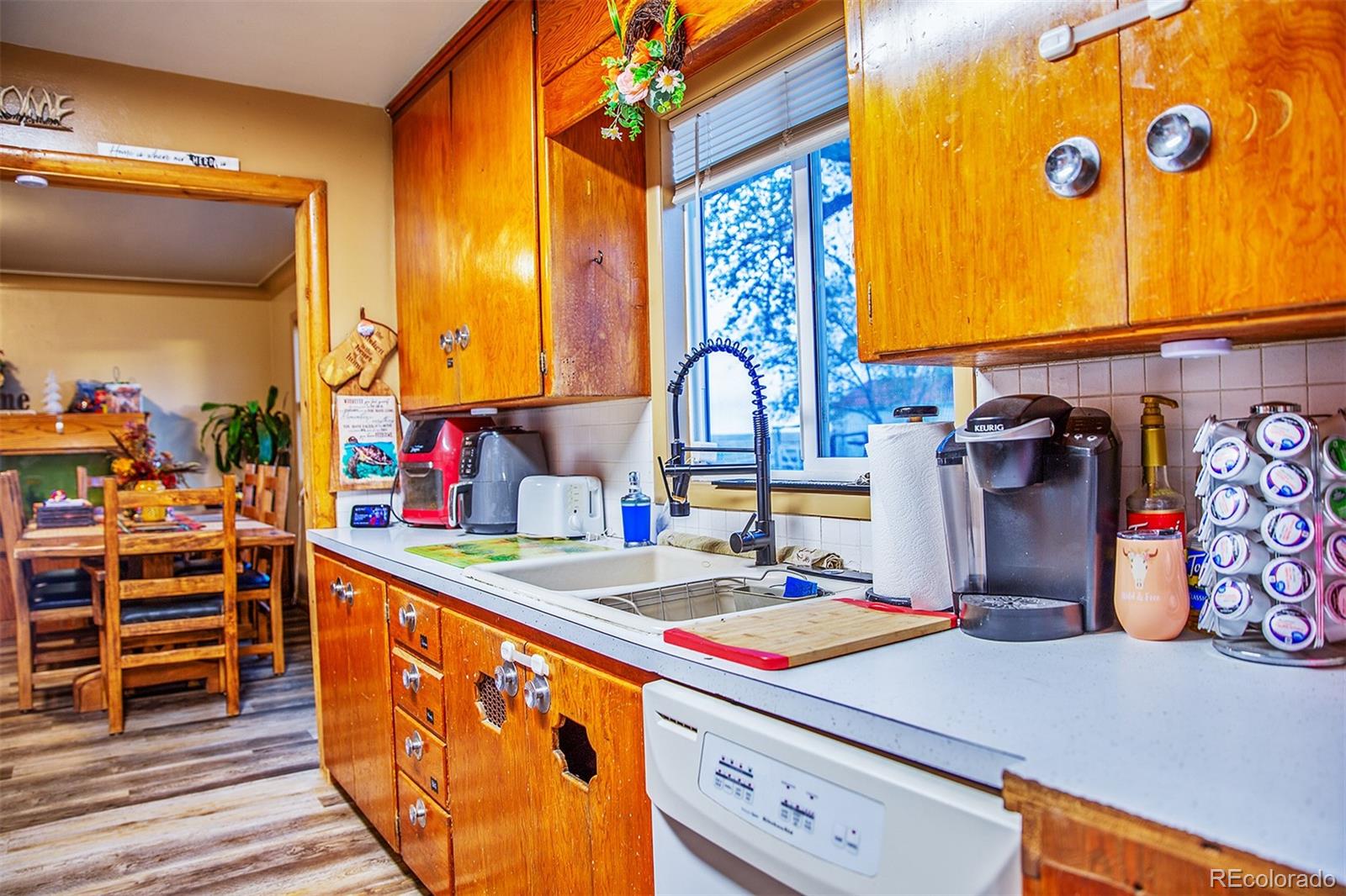 17754 County Road JJ Fort Morgan, CO 80701 - Photo 18 of 33 a kitchen that has a lot of cabinets a sink and a stove