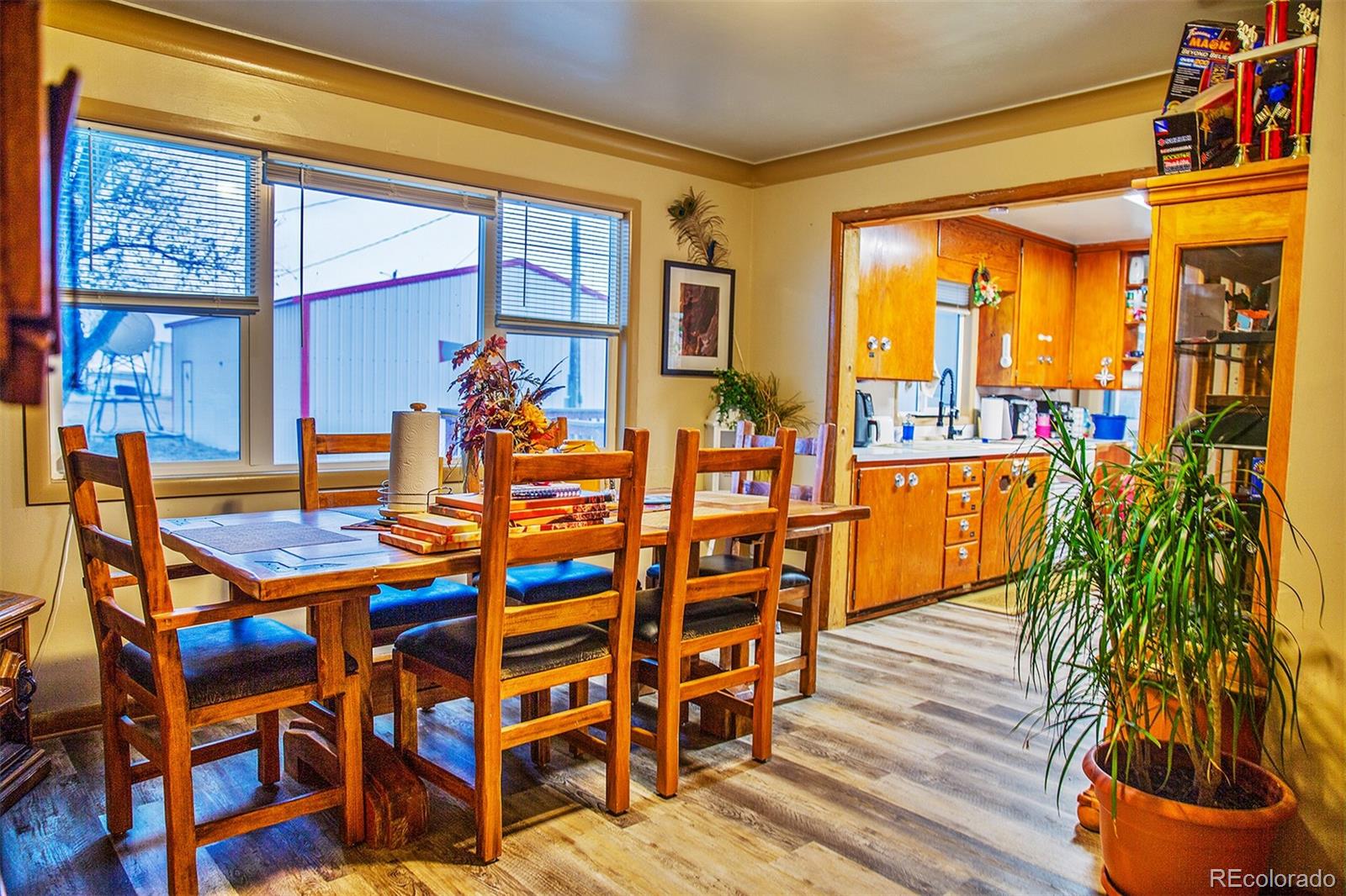 17754 County Road JJ Fort Morgan, CO 80701 - Photo 20 of 33 a dining room filled with furniture and a floor to ceiling window
