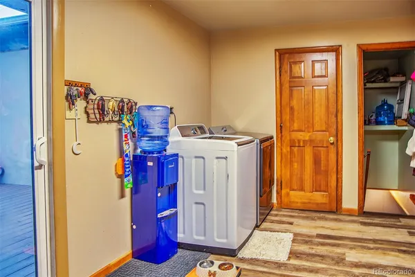 a bedroom with furniture and a flat screen tv