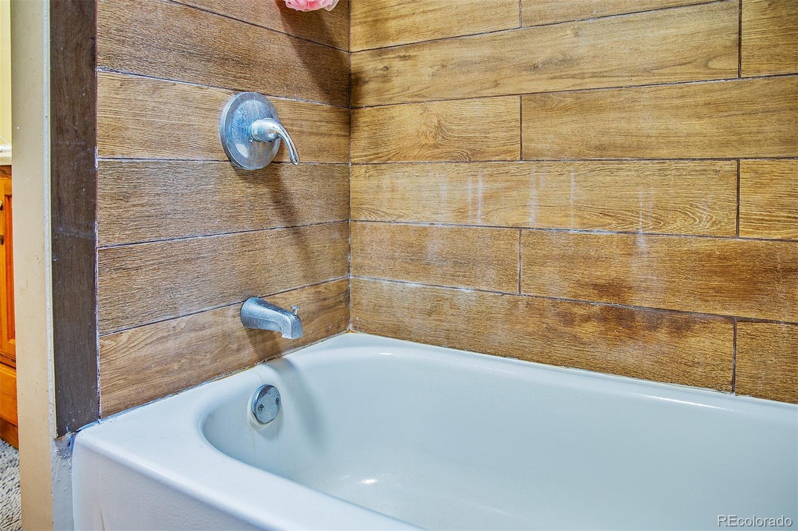 17754 County Road JJ Fort Morgan, CO 80701 - Photo 29 of 33 a bathroom with a tub and a sink
