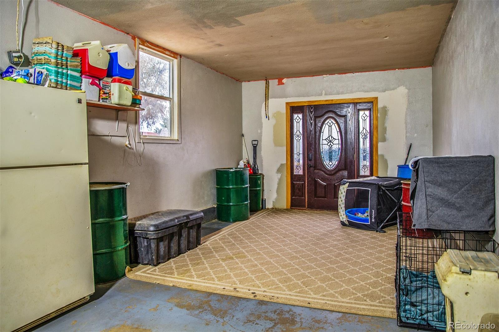 17754 County Road JJ Fort Morgan, CO 80701 - Photo 32 of 33 a living room with furniture a flat screen tv and a fireplace