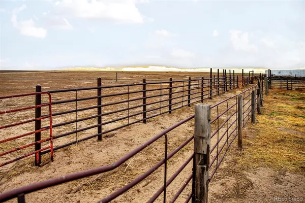 a front view of a house with glass top table and chairs