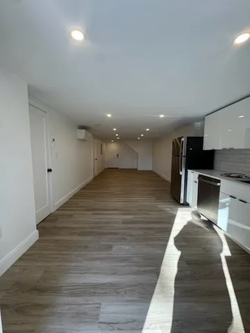 a view of kitchen with sink microwave and refrigerator