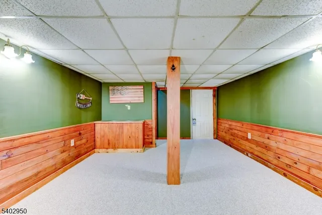 a view of an empty room with wooden walls