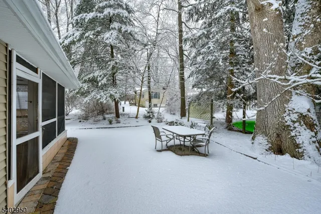a view of a house with backyard porch and sitting area