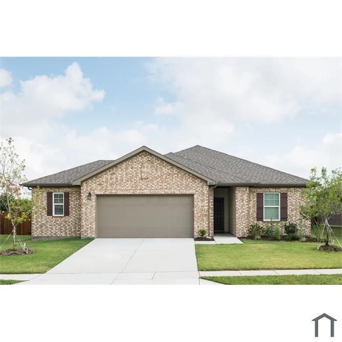 Brick exterior home featuring an attached two-car garage, concrete driveway, and front lawn