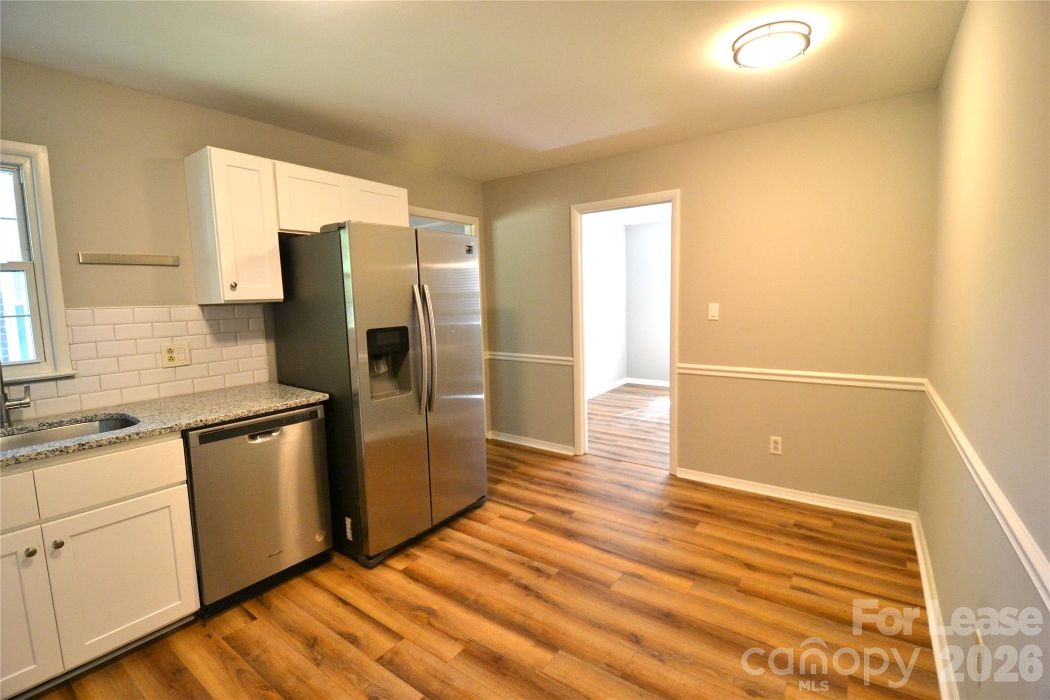 1422 Thermal Road Charlotte, NC 28212 - Photo 17 of 40 a kitchen with stainless steel appliances granite countertop a refrigerator and a stove