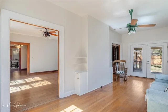 a view of livingroom with hardwood floor and a ceiling fan