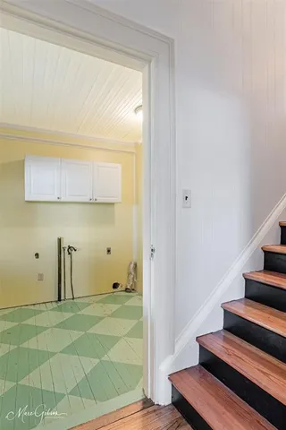a view of an empty room with stairs