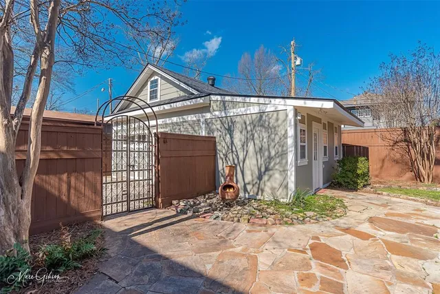 a view of a house with wooden walls