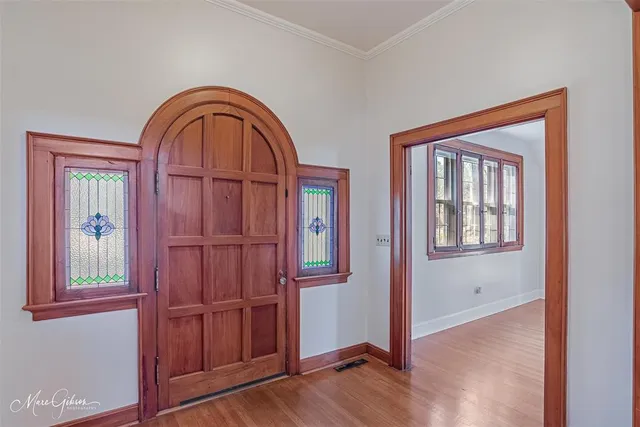 a view of an entryway with wooden floor