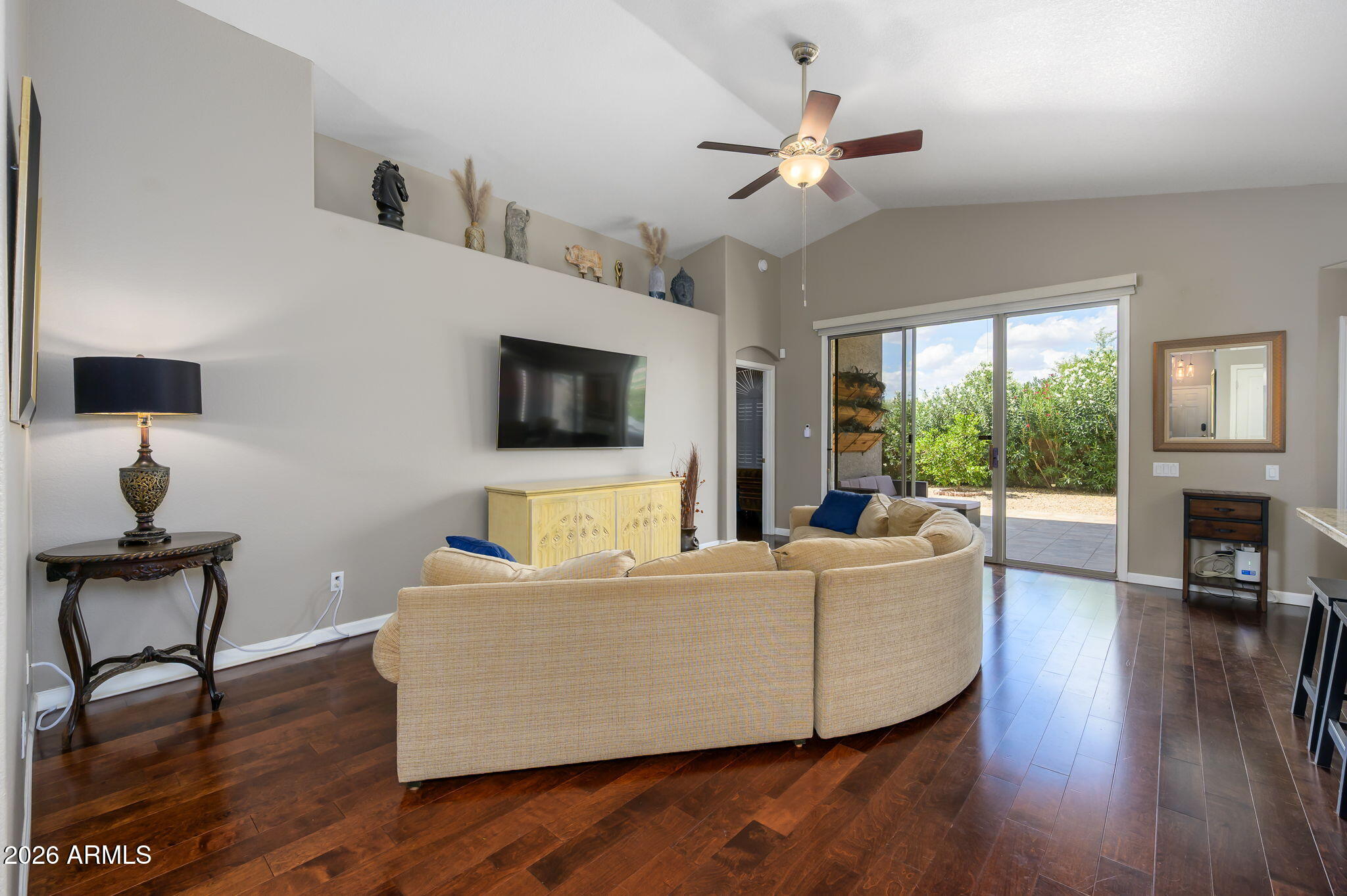 3136 East Roveen Avenue Phoenix, AZ 85032 - Photo 14 of 38 a living room with furniture and a flat screen tv