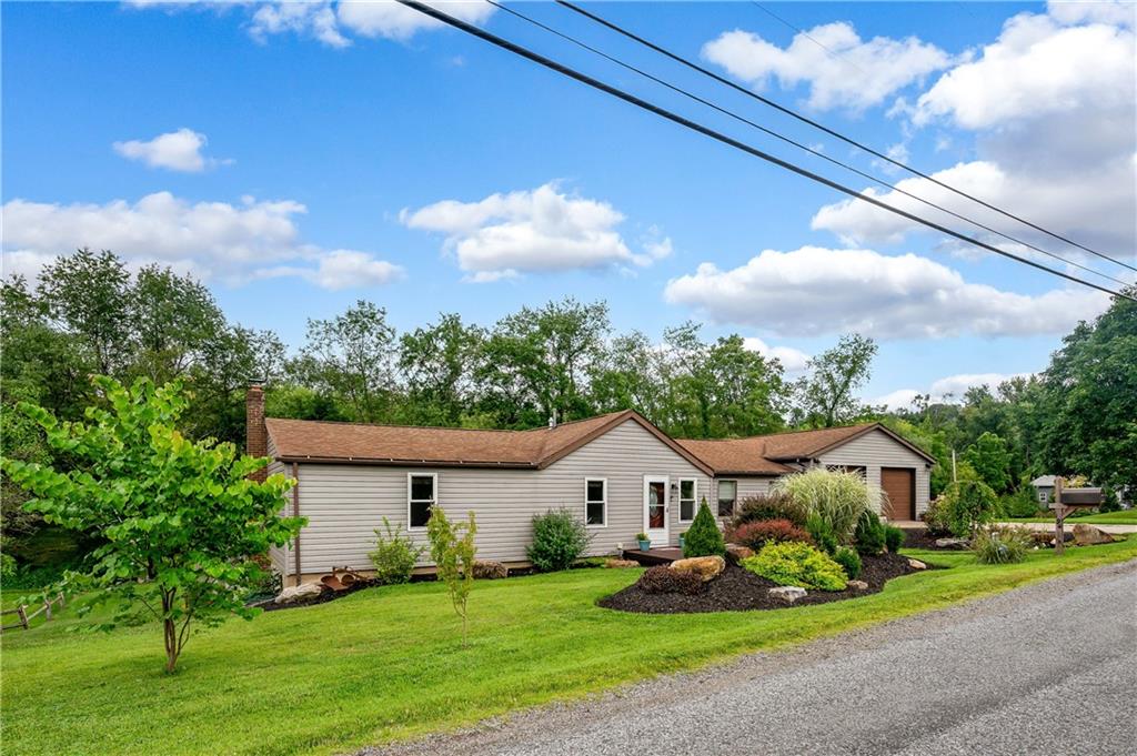194 Hepler Road Sarver, PA 16055 - Photo 2 of 30 a front view of house with garden and trees