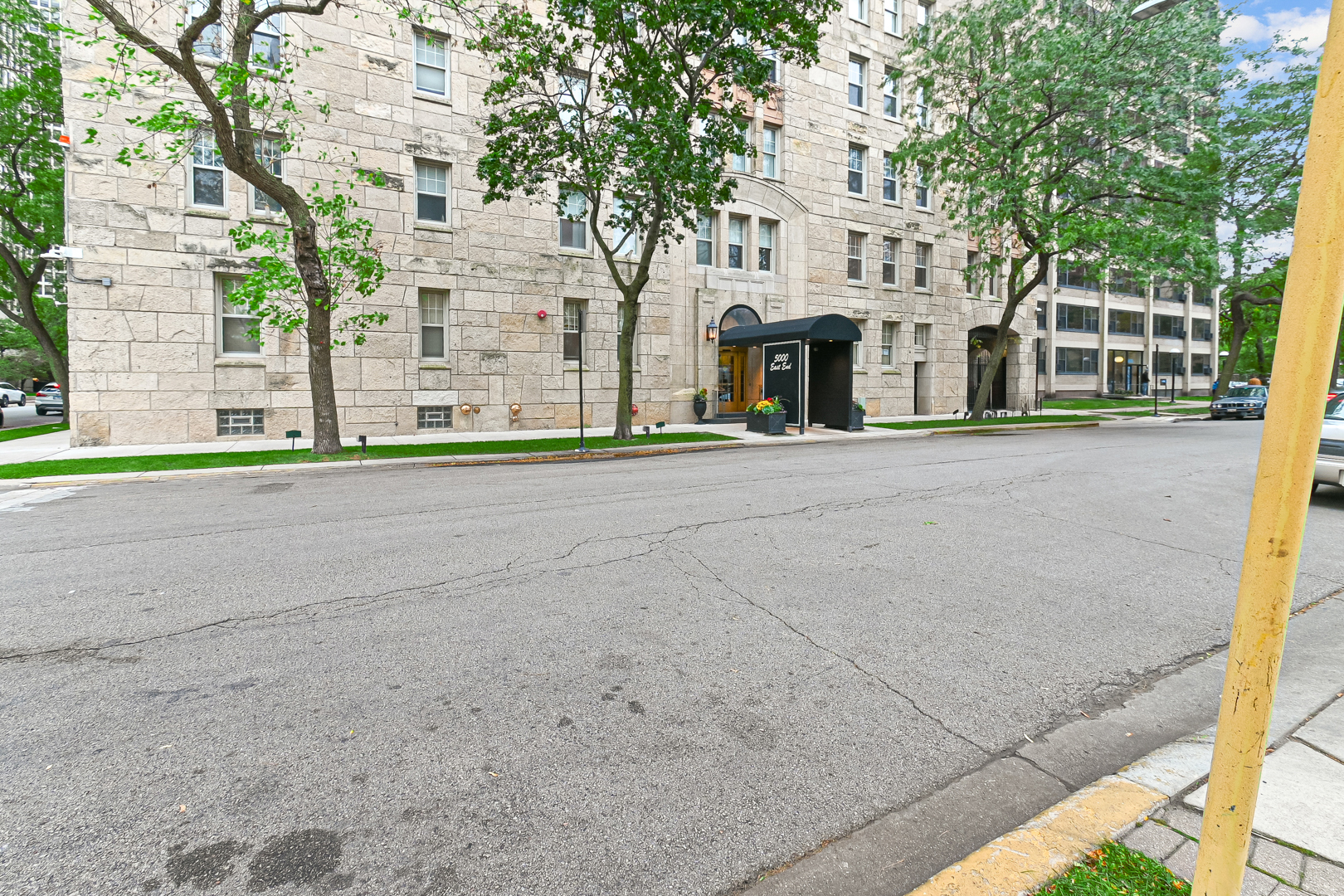 5000 South East End Avenue, Unit 2D Chicago, IL 60615 - Photo 2 of 22 a front view of a building with a road