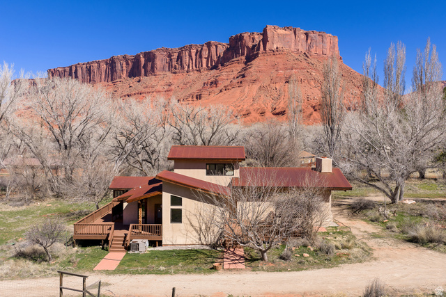 423 Amber Lane Moab, UT 84532 - Photo 44 of 63 West side of home with view of Parriott mesa