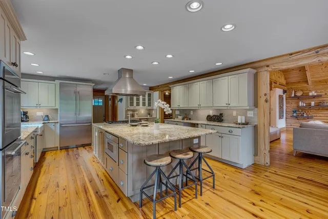 a living room with furniture and a book shelf
