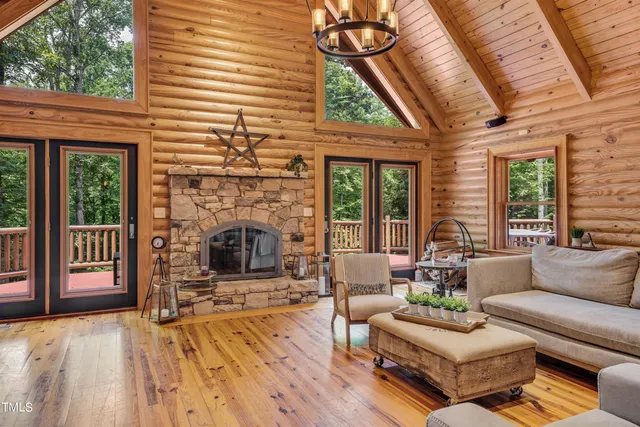 a dining room with furniture water view and a large window