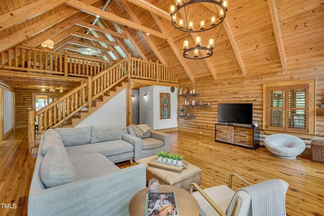 a spacious bedroom with a bed and a ceiling fan