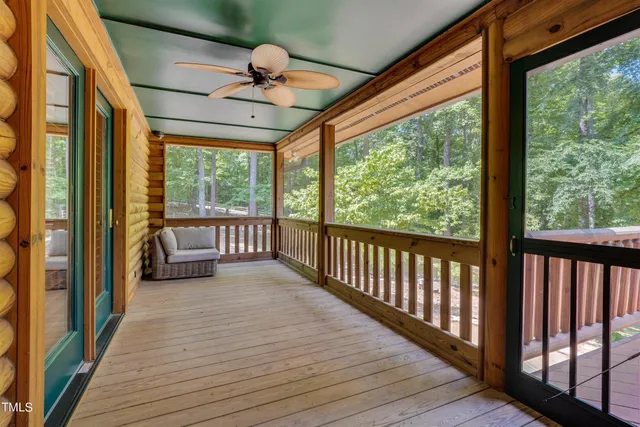 a spacious bedroom with a bed and a table in it