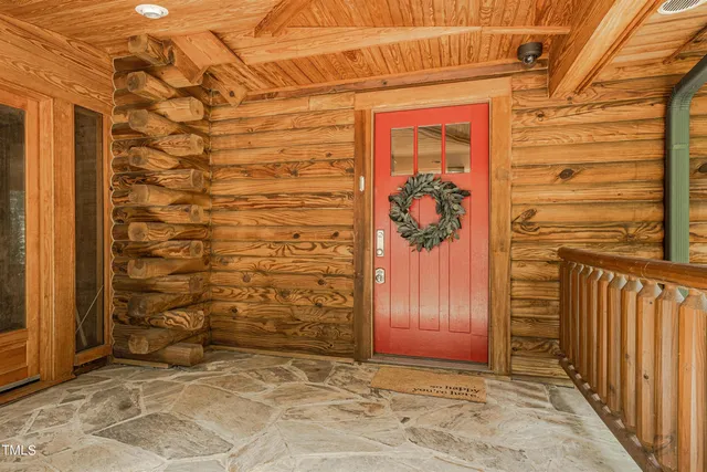 a kitchen with kitchen island granite countertop a sink stove and cabinets