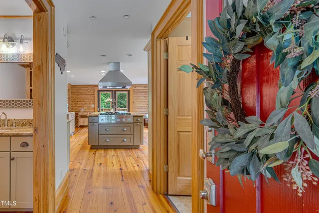 a kitchen with kitchen island granite countertop lots of counter top space and stainless steel appliances