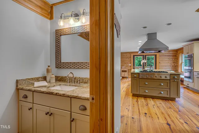 a kitchen with a sink stainless steel appliances and cabinets
