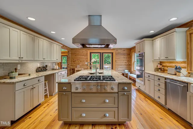 a living room with furniture flat screen tv and a fireplace