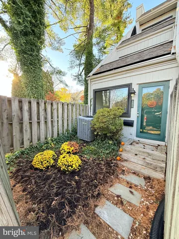 a view of a house with a flower garden