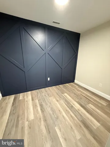 a view of a room with a bed