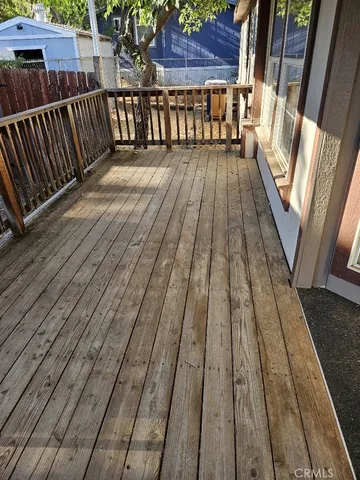 a view of balcony with wooden floor