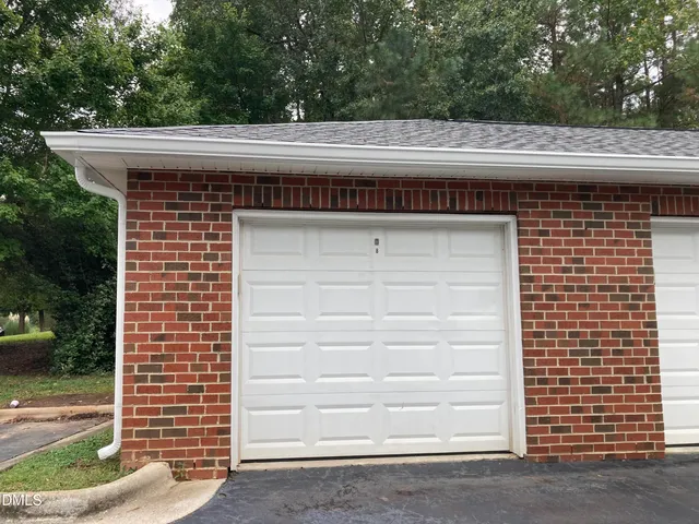 a view of garage and yard