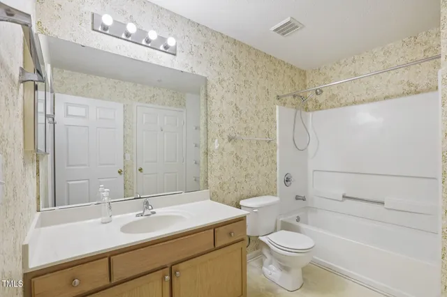 a bathroom with a sink a mirror and a shower