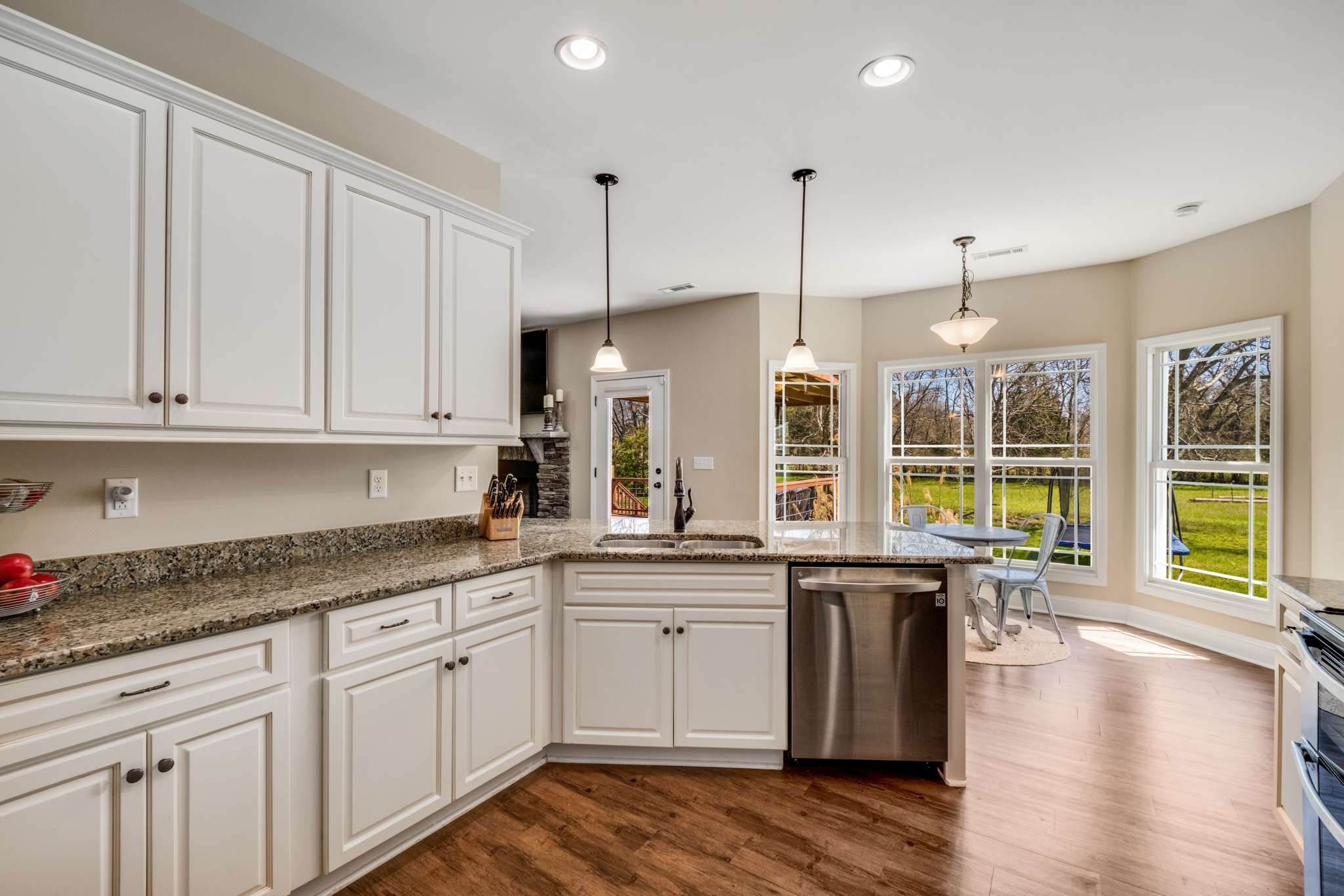 2799 Cairo Bend Road Lebanon, TN 37087 - Photo 20 of 45 a open kitchen with granite countertop a sink a counter space appliances and cabinets
