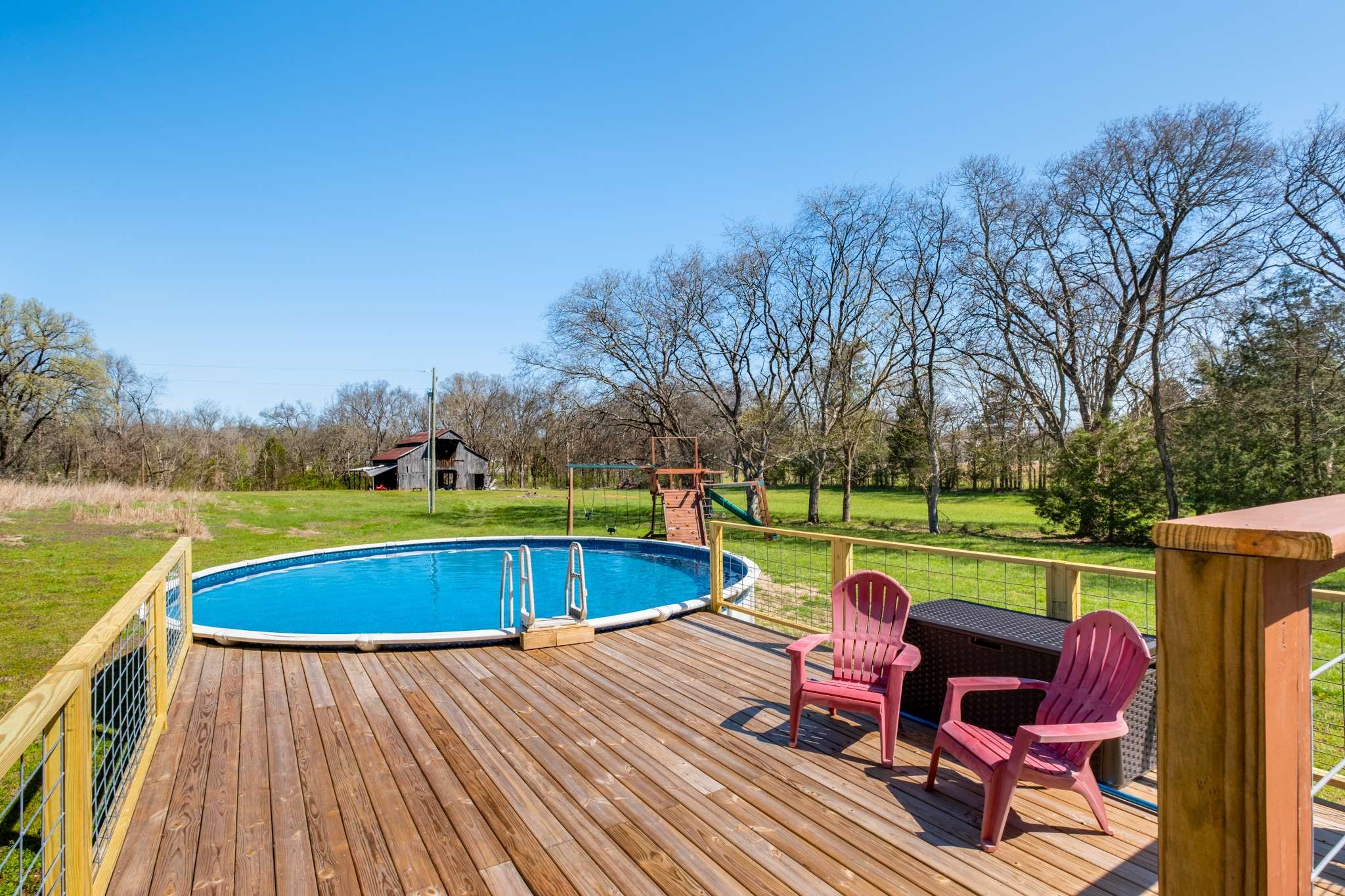 2799 Cairo Bend Road Lebanon, TN 37087 - Photo 33 of 45 a view of swimming pool with seating space and trees in the background