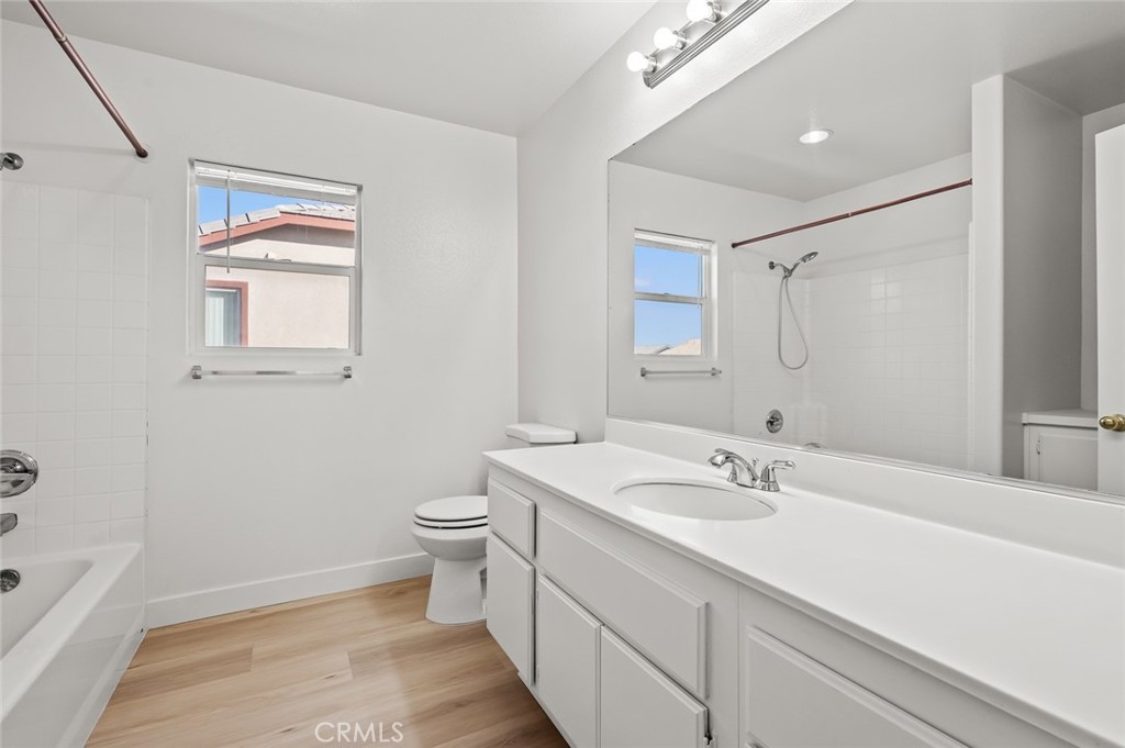 6323 Scalea Court Palmdale, CA 93552 - Photo 37 of 58 a bathroom with a double vanity sink toilet and shower