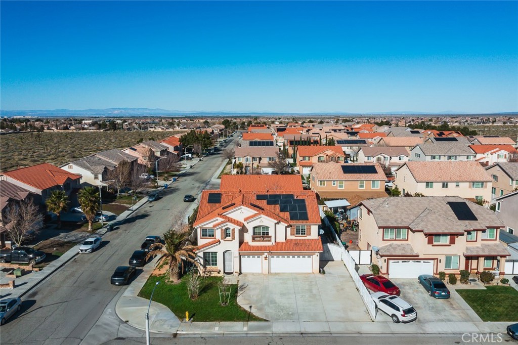 6323 Scalea Court Palmdale, CA 93552 - Photo 58 of 58 an aerial view of residential houses with outdoor space