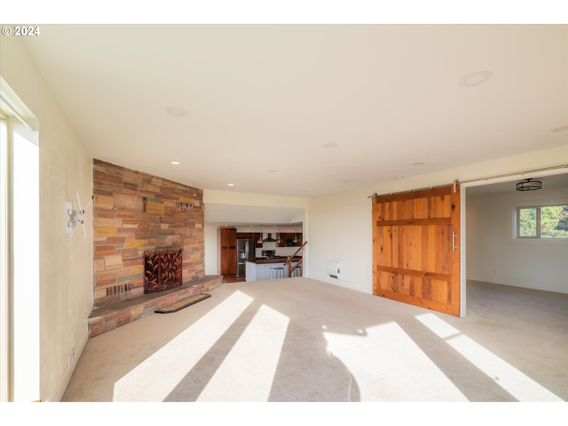 1190 Beach Loop Road Bandon, OR 97411 - Photo 14 of 39 a view of livingroom with furniture and cabinet with floor to ceiling window