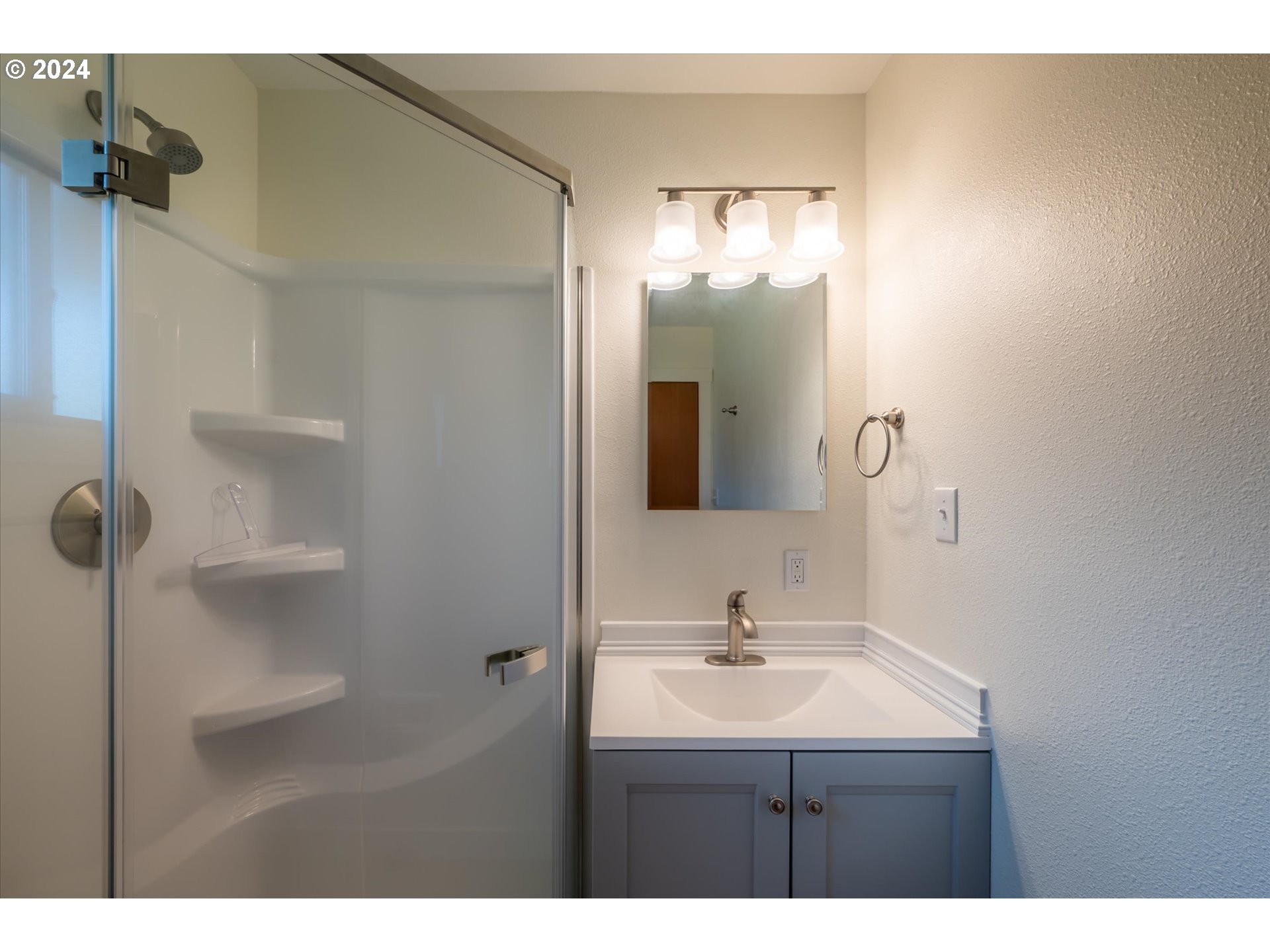 1190 Beach Loop Road Bandon, OR 97411 - Photo 17 of 39 a bathroom with a sink and a mirror