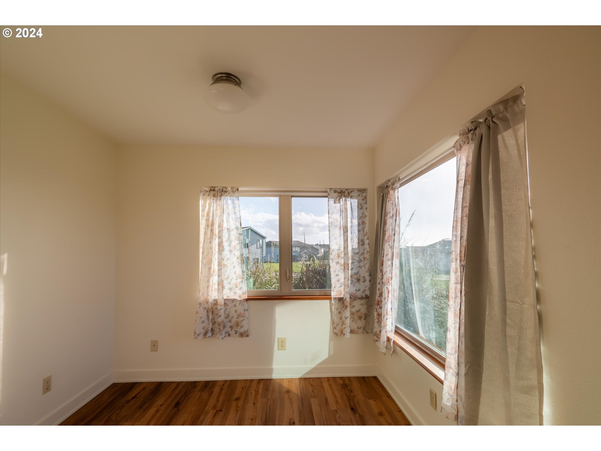 1190 Beach Loop Road Bandon, OR 97411 - Photo 18 of 39 a view of an empty room with a window