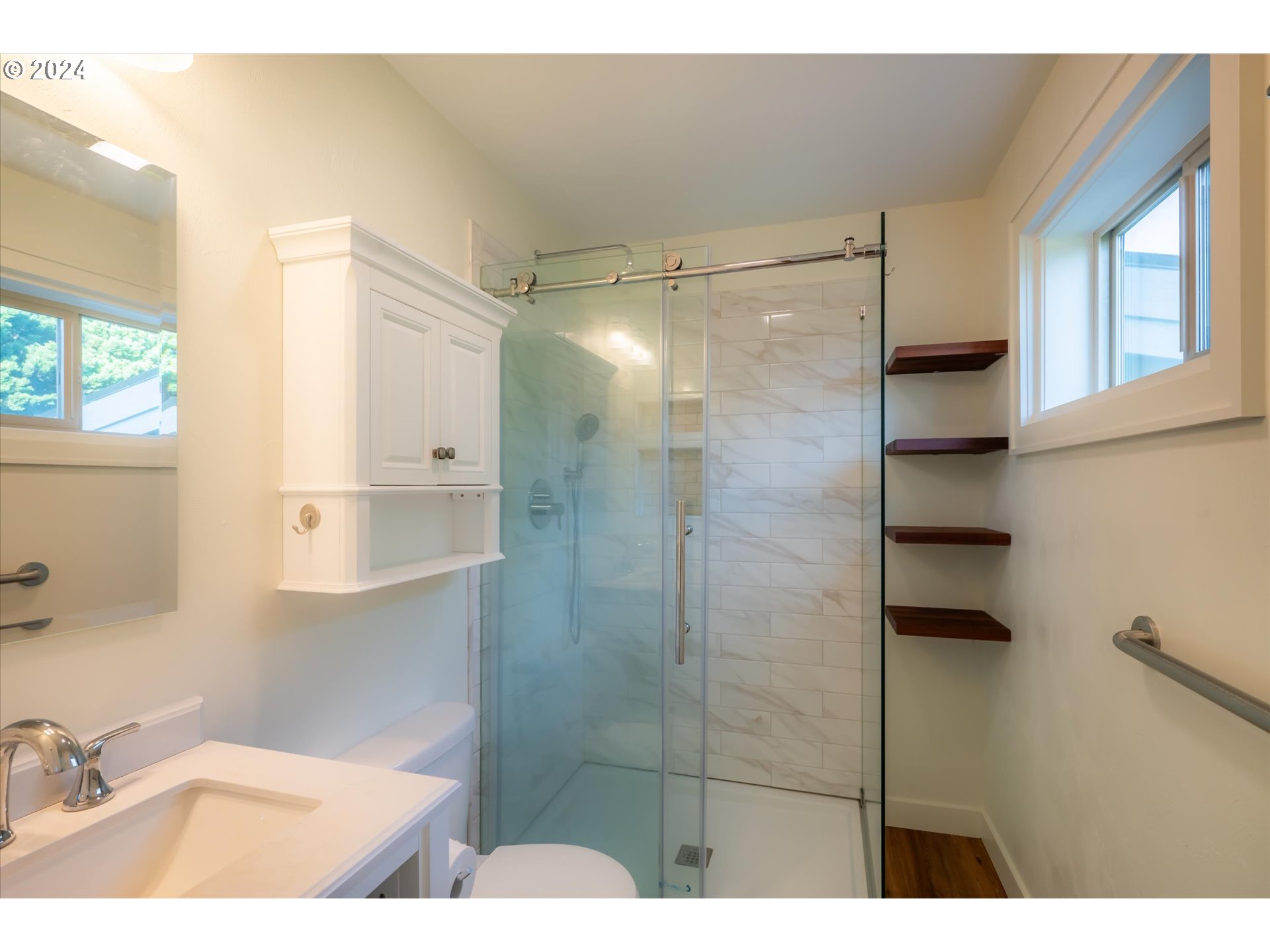 1190 Beach Loop Road Bandon, OR 97411 - Photo 26 of 39 a bathroom with a granite countertop sink mirror and shower