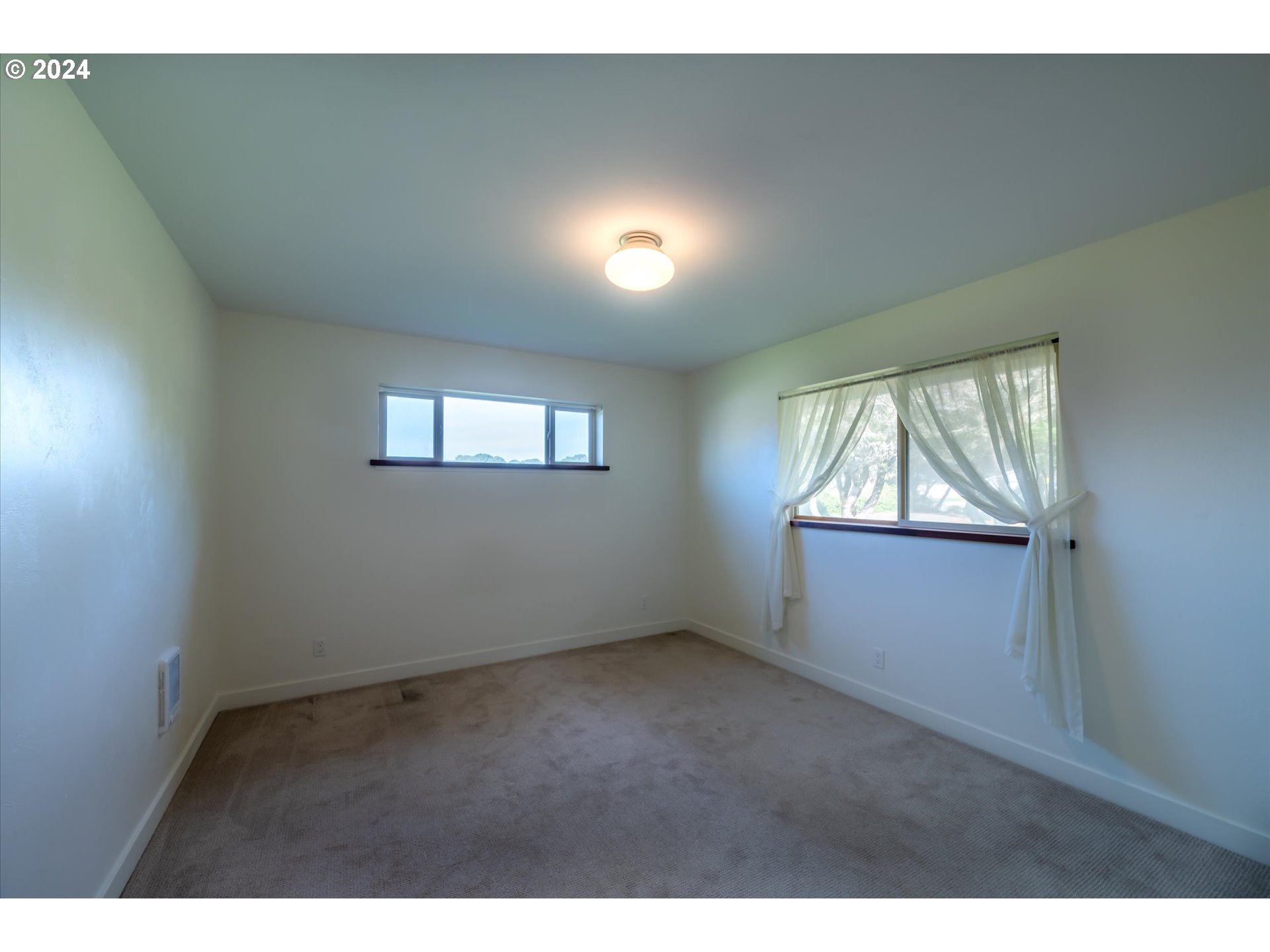 1190 Beach Loop Road Bandon, OR 97411 - Photo 28 of 39 a view of an empty room with a window