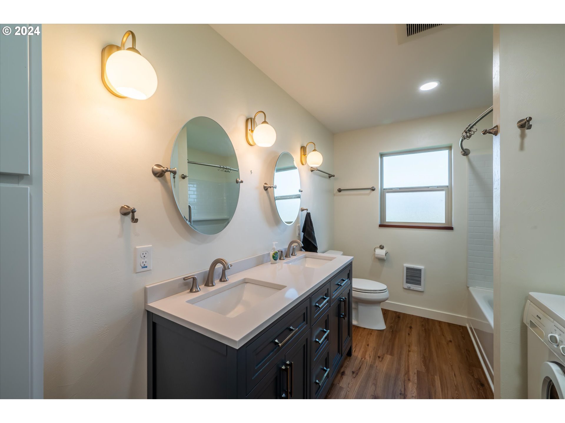 1190 Beach Loop Road Bandon, OR 97411 - Photo 29 of 39 a bathroom with a sink mirror and toilet